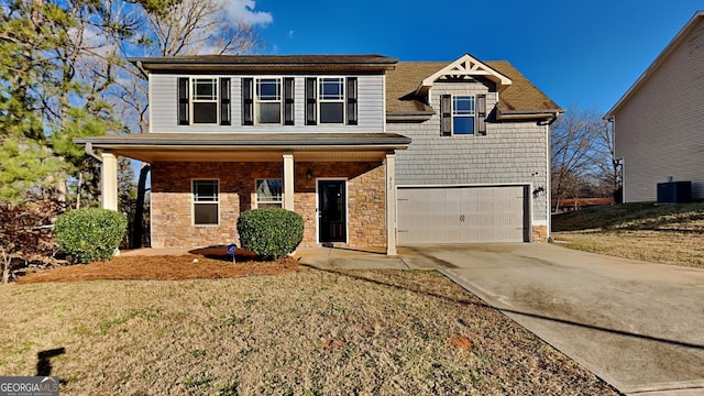 view of front facade featuring central AC, a front lawn, a porch, and a garage