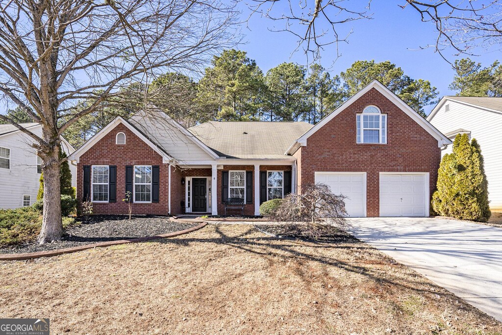 928 Buckhorn Bnd, Locust Grove, GA 30248 - view of front property featuring a garage