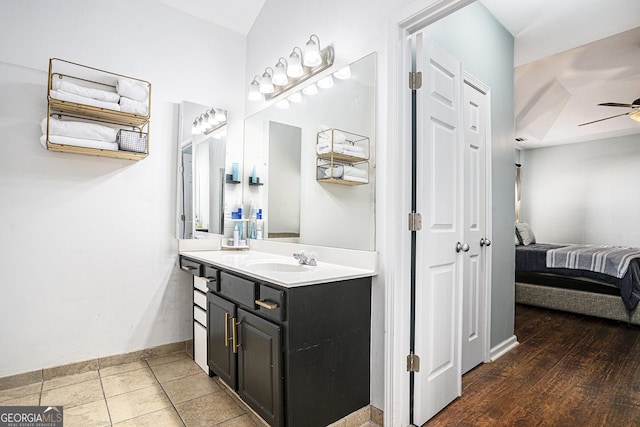 bathroom featuring vanity, tile patterned floors, and ceiling fan