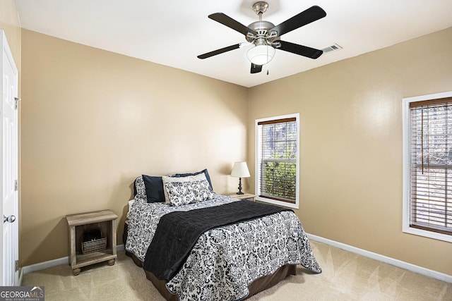 carpeted bedroom with ceiling fan