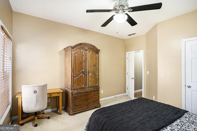 bedroom featuring light colored carpet and ceiling fan