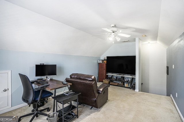 carpeted office space with lofted ceiling and ceiling fan