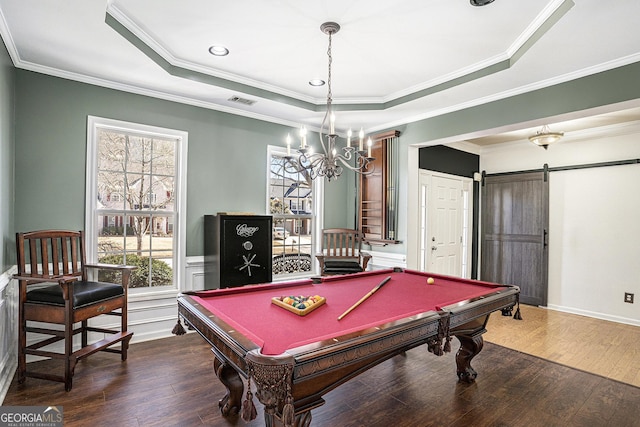 recreation room featuring crown molding, a barn door, billiards, and a tray ceiling