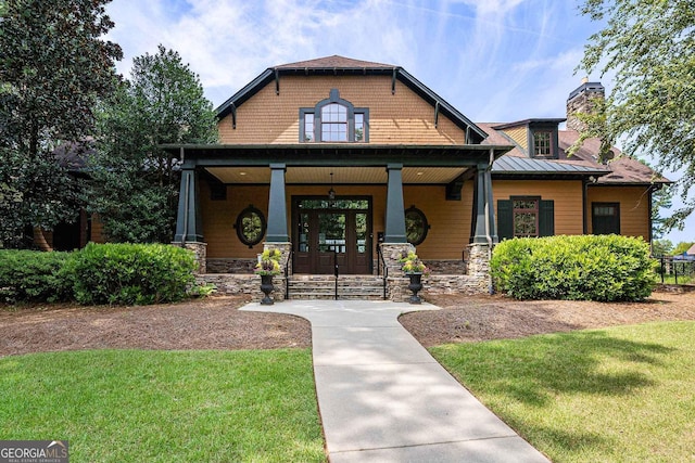 view of front of property with a front lawn and a porch