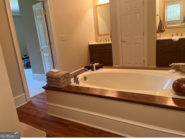 bathroom featuring vanity and hardwood / wood-style flooring