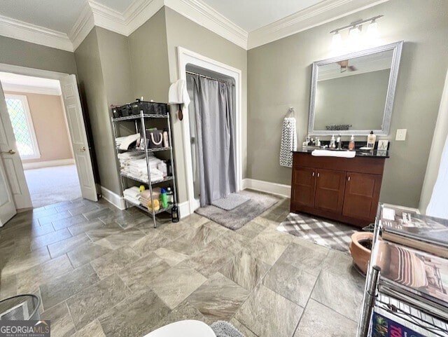 bathroom featuring vanity and crown molding