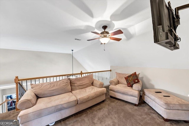 carpeted living room with ceiling fan and lofted ceiling