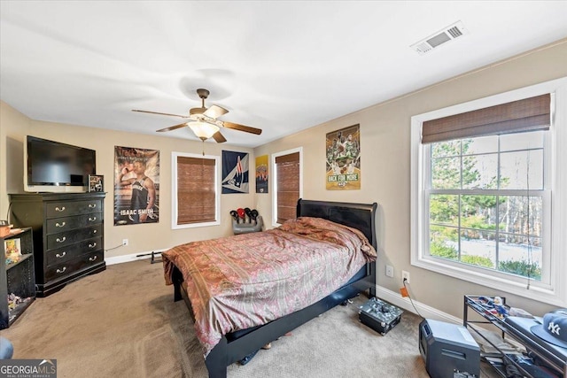 carpeted bedroom with ceiling fan