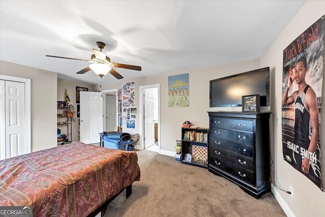 bedroom featuring ceiling fan and carpet