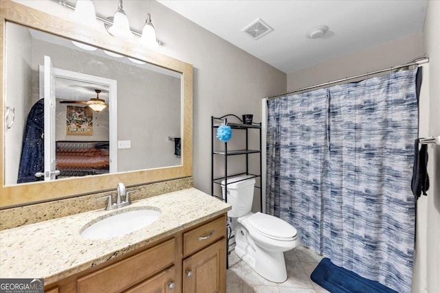 bathroom featuring a shower with curtain, vanity, and toilet