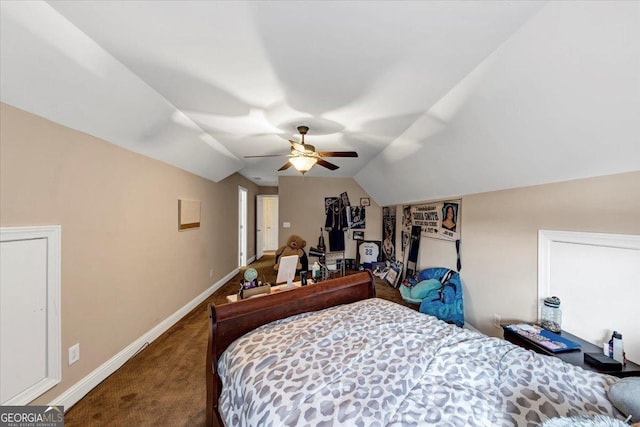 carpeted bedroom with vaulted ceiling and ceiling fan