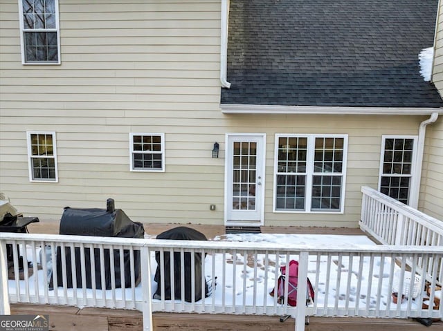 wooden terrace featuring a grill