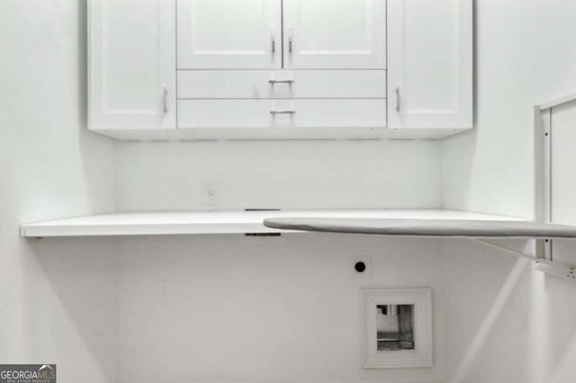 washroom featuring cabinets and hookup for an electric dryer