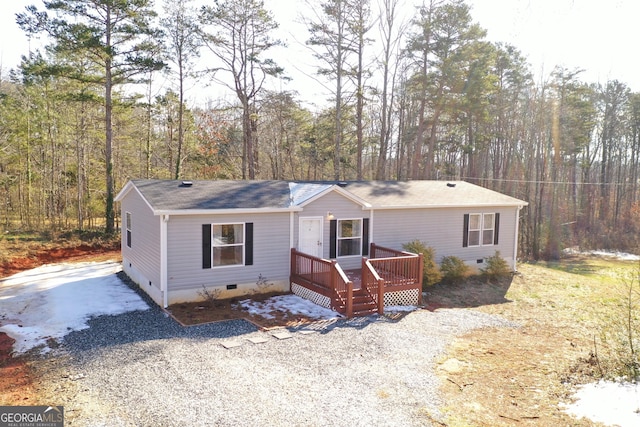 view of front of house with a wooden deck