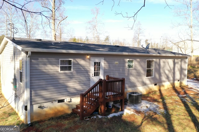 rear view of property featuring cooling unit