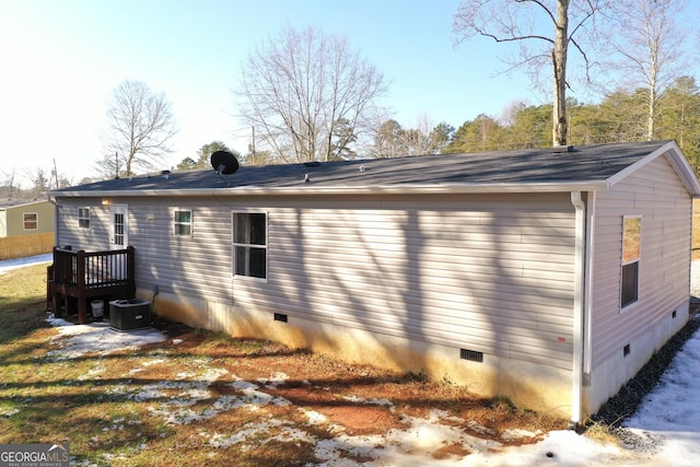 back of property featuring cooling unit