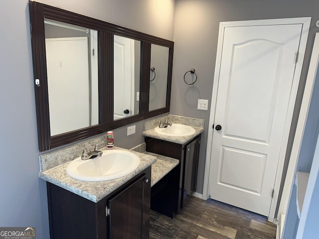 bathroom with vanity and wood-type flooring