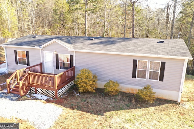 view of front of home with a wooden deck