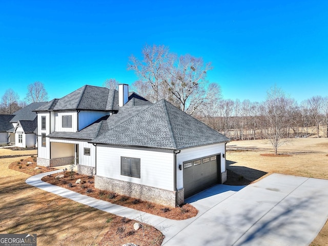 view of side of home with a garage