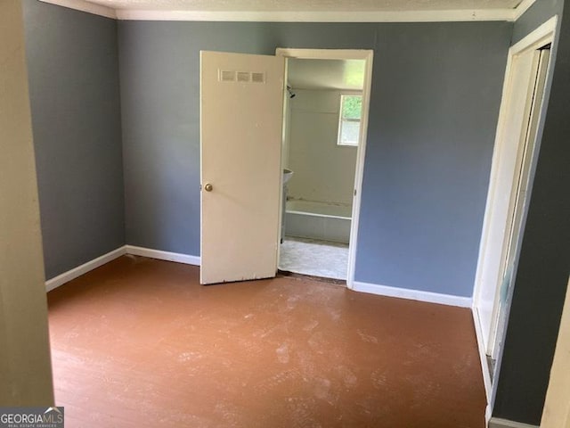 unfurnished bedroom featuring a textured ceiling