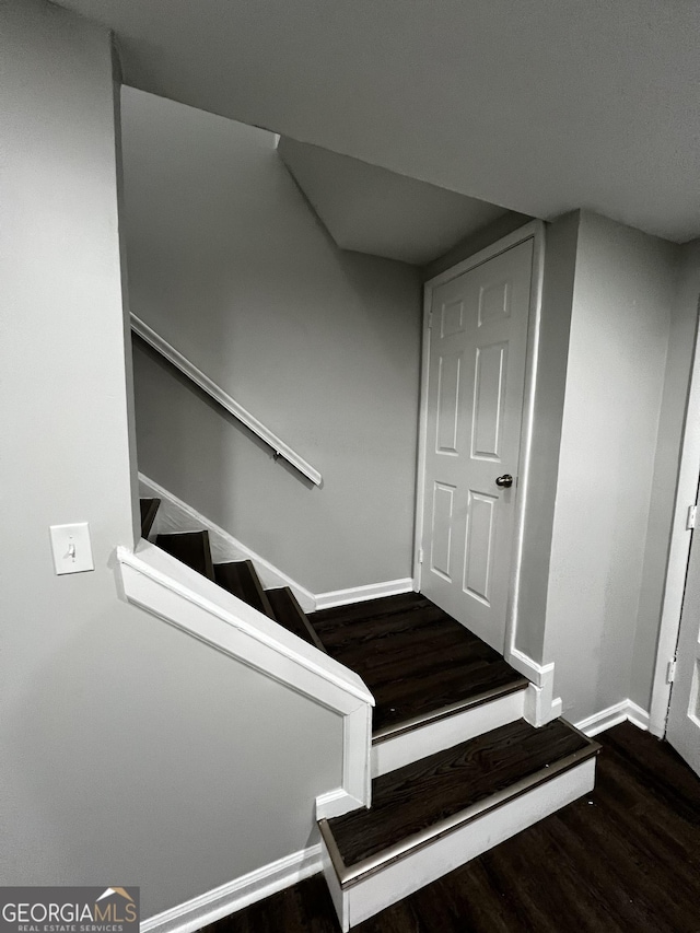 stairway with wood-type flooring