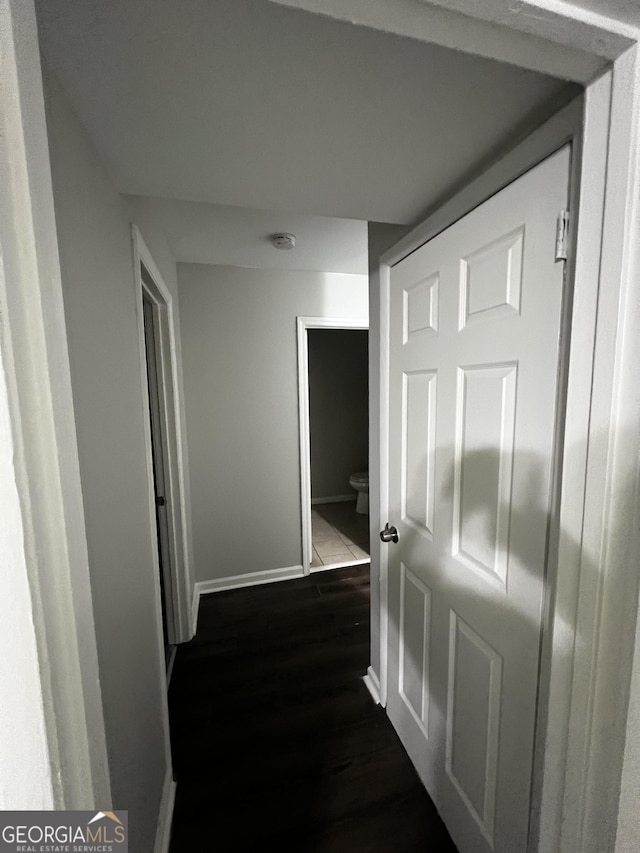 hall featuring dark wood-type flooring