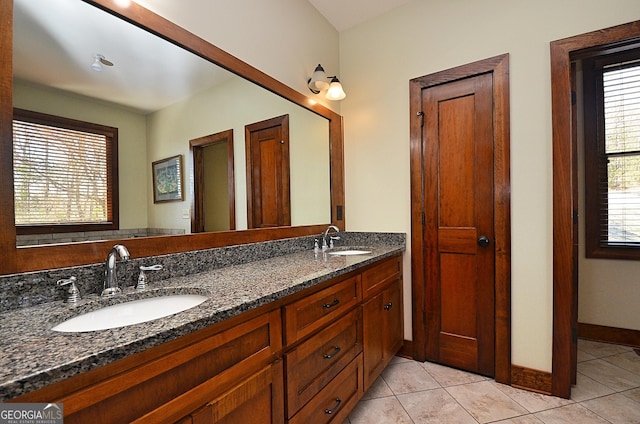 bathroom with tile patterned flooring and vanity