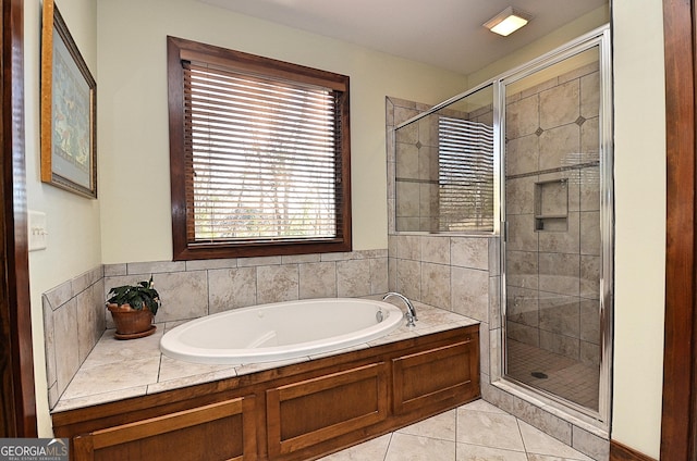 bathroom with tile patterned floors and plus walk in shower