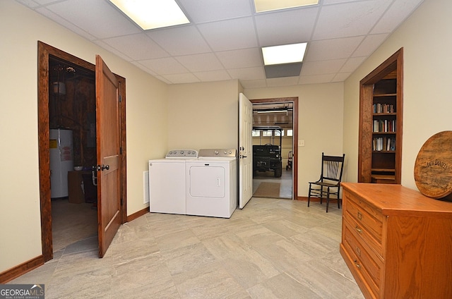 laundry area featuring gas water heater and washing machine and dryer