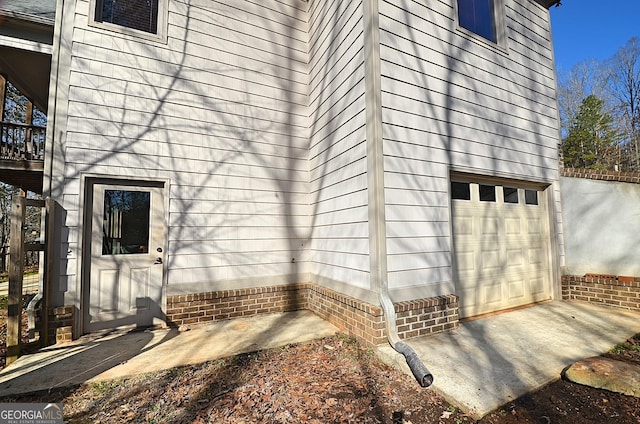 view of side of property with a garage