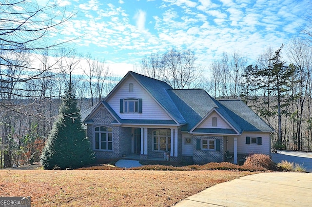 view of front of home featuring a porch and a front yard