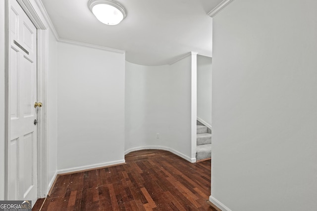 hallway with ornamental molding and dark wood-type flooring