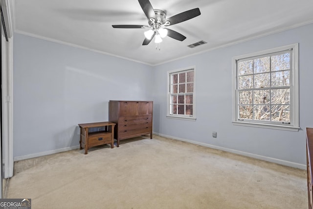 carpeted bedroom featuring ornamental molding and ceiling fan