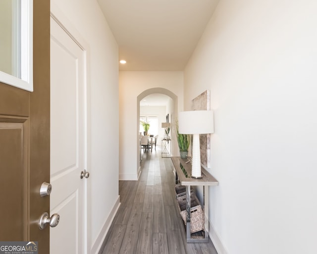 hall with wood-type flooring