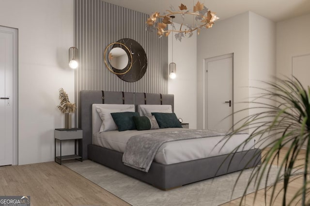 bedroom with a notable chandelier and light wood-type flooring