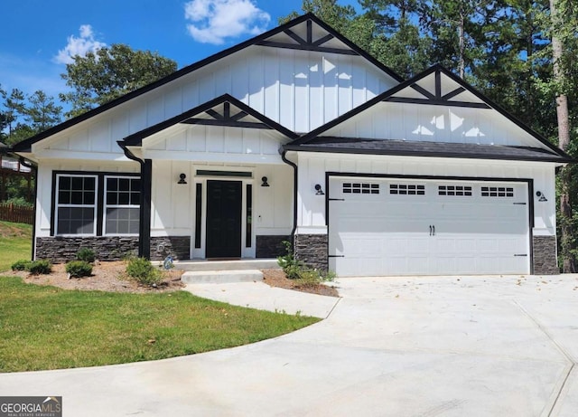 view of front of house with a garage and a front lawn