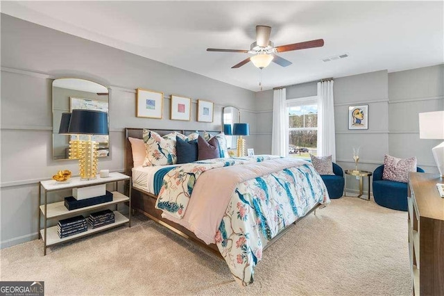 carpeted bedroom with ceiling fan