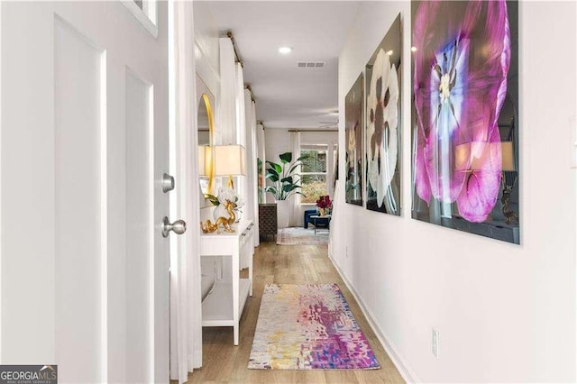 corridor featuring light hardwood / wood-style flooring