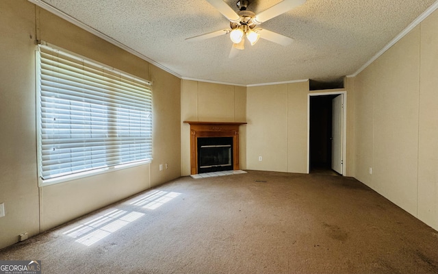 unfurnished living room with ceiling fan, crown molding, light colored carpet, and a textured ceiling