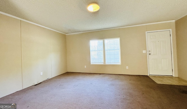 carpeted spare room with crown molding and a textured ceiling