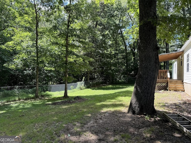 view of yard featuring a deck