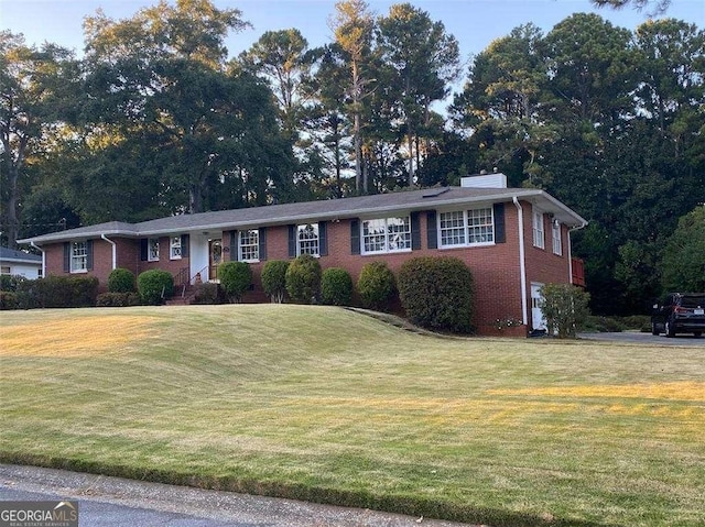 ranch-style house with a front lawn