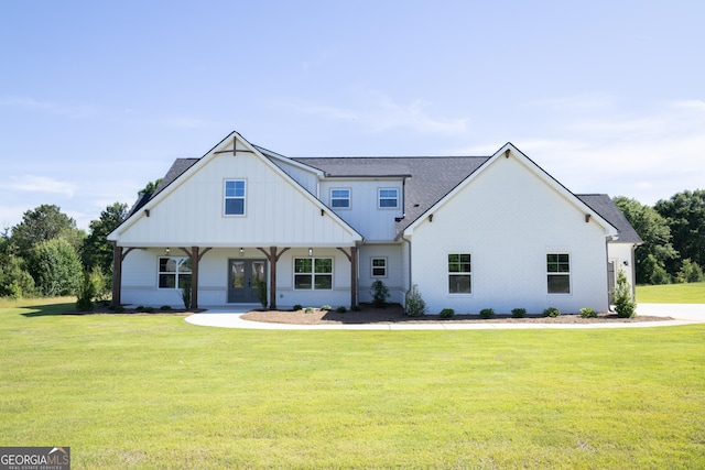 184 Grove Park Unit 11, Senoia, GA 30276 - modern farmhouse style home featuring french doors, a front yard, board and batten siding, and roof with shingles