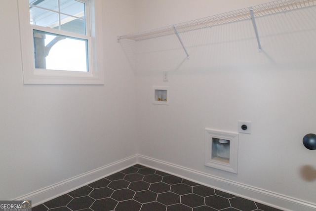184 Grove Park Unit 11, Senoia, GA 30276 - laundry area featuring electric dryer hookup, hookup for a washing machine, dark tile patterned floors, and baseboards