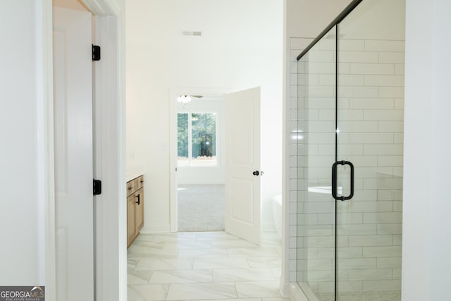 184 Grove Park Unit 11, Senoia, GA 30276 - bathroom with vanity, a stall shower, marble look tile flooring, a bathtub, and baseboards