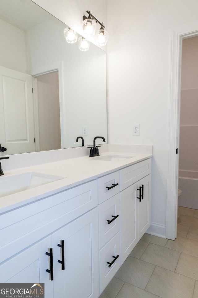 184 Grove Park Unit 11, Senoia, GA 30276 - full bathroom with double vanity and tile patterned floors