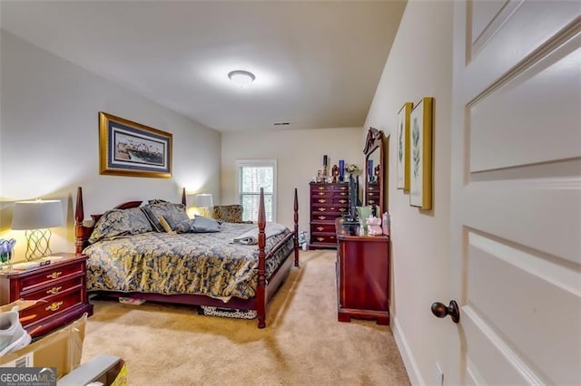 bedroom featuring light carpet