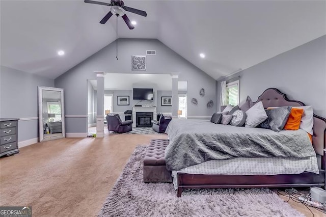 carpeted bedroom featuring ceiling fan and vaulted ceiling