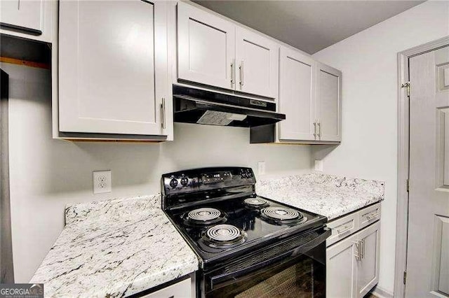 kitchen featuring white cabinetry, black electric range oven, and light stone counters