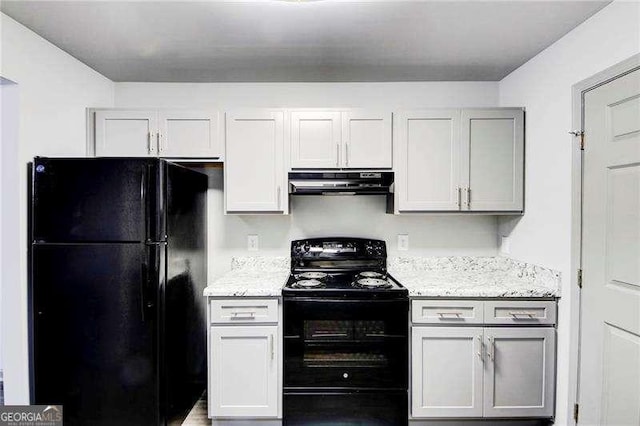 kitchen with light stone countertops and black appliances